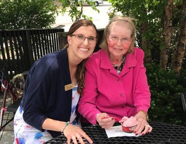 Image of resident with senior living staff member
